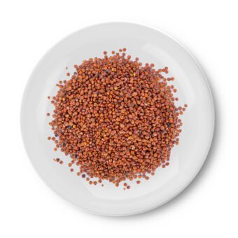 Quinoa in a plate on white background